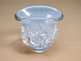 a glass vase that is sitting on a table
