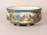 a bowl with a painting on it on a stand
