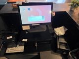a computer sitting on top of a desk in a room