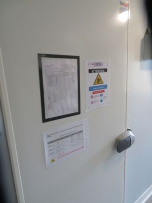 a white refrigerator with a bunch of papers on it