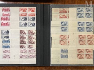 two pages of stamps in a folder on a table