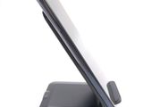 a cell phone that is sitting on top of a cell phone stand