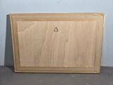a picture of a wooden cutting board with a triangle on it