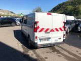 a white van that is parked in a parking lot