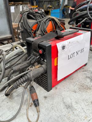 a lot of wires on the ground next to a lot of wires