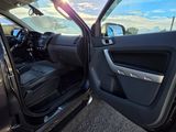 a view of the inside of a car from the driver ' s seat