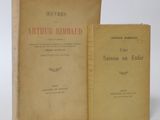 two books sitting next to each other on a white surface