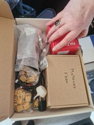 a person that is opening a box of food