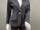 an image of a mannequin wearing a black jacket and leggings