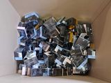 a cardboard box filled with many different types of electronic devices