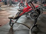 a gym with a lot of machines in the room