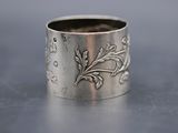 a close up of a silver ring on a table