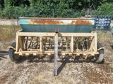 an image of a tractor with a planter attached to it