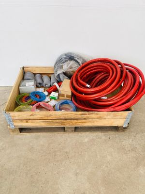 a wooden crate with a bunch of different types of hoses