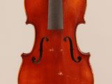 an old violin with a bow hanging from it ' s back
