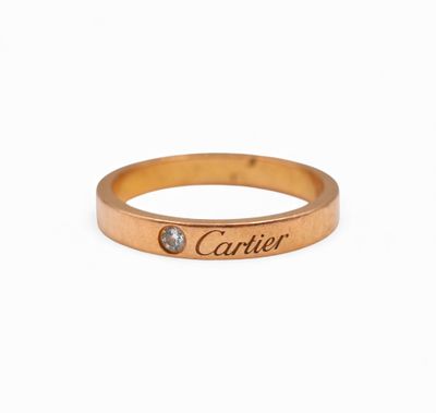 a close up of a gold ring with a name engraved on it