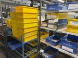 many yellow boxes on the shelves in the warehouse