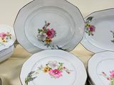a lot of plates that are sitting on a table