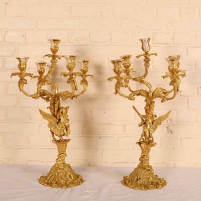 pair of antique brass candelabs with birds and flowers