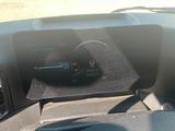 a car dashboard with a digital display on it