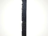 a black marble column with a white base and a black marble base