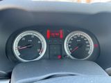 a close up of a car dashboard with a speedometer and gauges