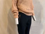 an image of a mannequin wearing a sweater and pants