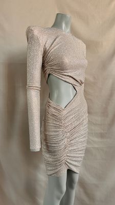 a mannequin dress with a cut out back and long sleeves