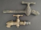 two old faucets that are sitting on a table