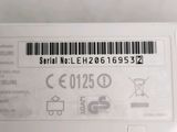 the back of a white cell phone with a bar code on it