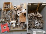a box full of assorted metal items on the floor