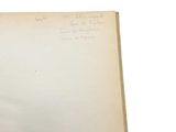 an open book with writing on it sitting on a table