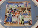 a plate with a painting on it on a table