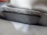 the inside of a handbag with a leather label on it