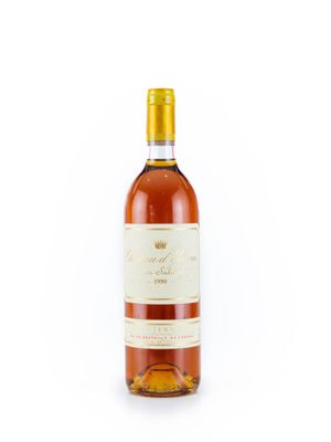 la bouteille de vin est posée sur une surface blanche