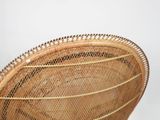 an image of a wicker chair on a white background