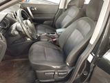 the interior of a car with black seats and a steering wheel