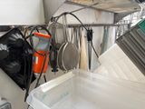 a picture of a kitchen with pots and pans hanging from the ceiling