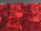 a red dress that is sitting on a table