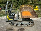 a small excavator that is sitting in the dirt