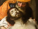 an image of a painting of a man laying on the ground next to a man in a turban