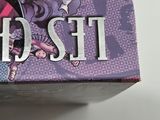someone is holding a box of chocolate with a picture of a girl on it