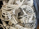 a suitcase full of wires and cords on the floor