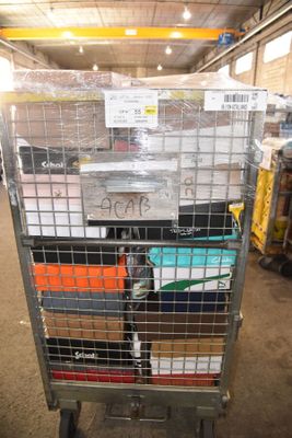a large metal cart with many boxes on top of it