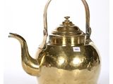 an antique brass teapot with a handle on a white background