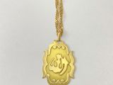 a gold plated necklace with a smiling face on it