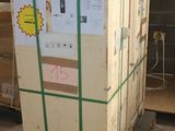 a pallet with a large box on it in a warehouse