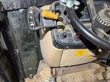 a close up of a fork and a steering wheel on a forklift