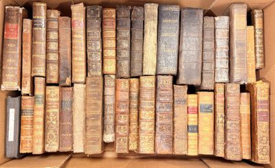 a box full of old books sitting on a table
