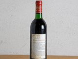 a bottle of wine sitting on a wooden table